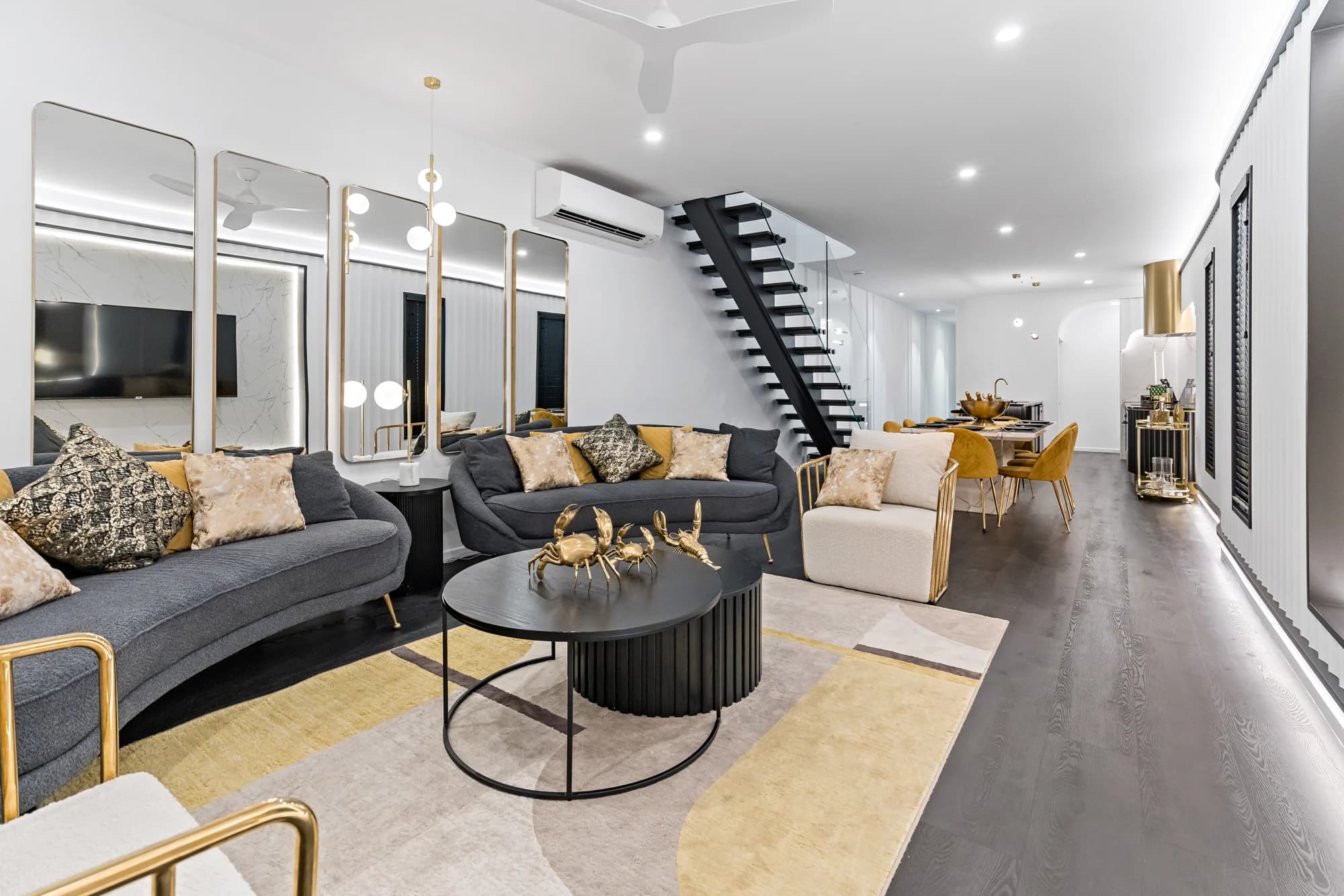 Open-plan living and staircase at Lavish