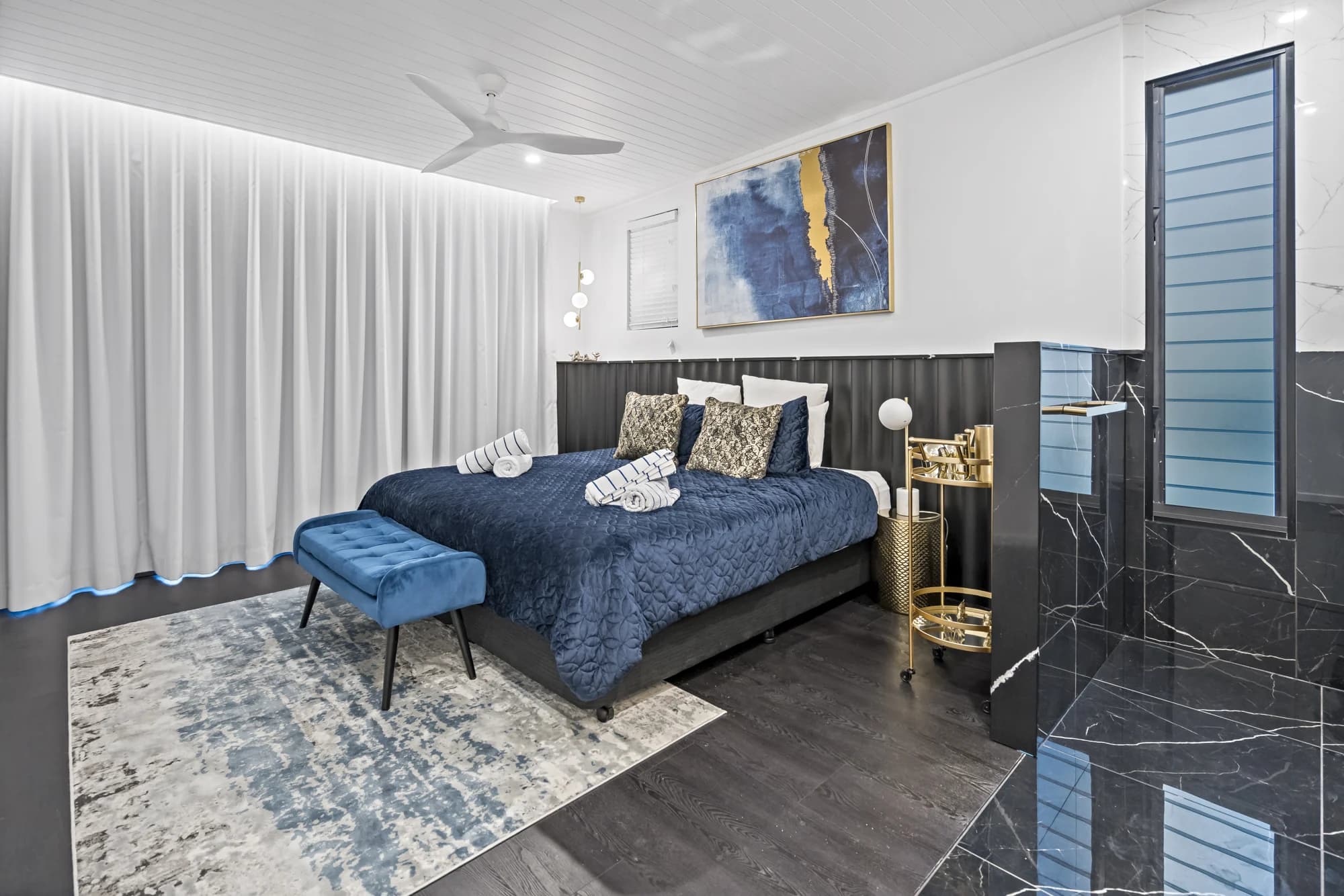 Bedroom with blue accents at No. 2