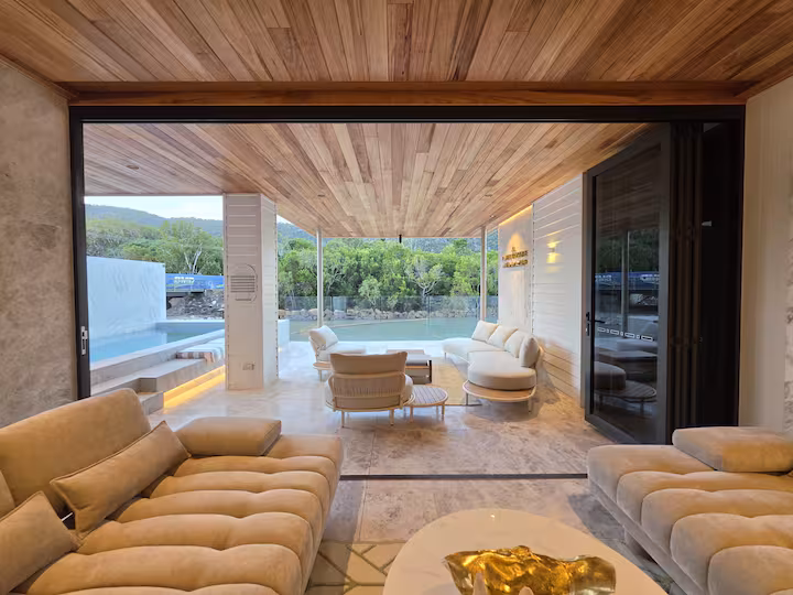 Indoor-outdoor living and pool view at Dacha Prestige